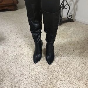 Leather high heel boots.